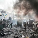 Hypersonic Missiles Pound Kyiv – What’s Next? A chaotic protest scene with smoke, fire, and people holding flags