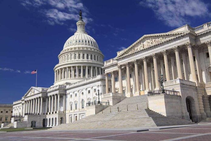 The U.S. Capitol building with its dome and columns under a blue sky