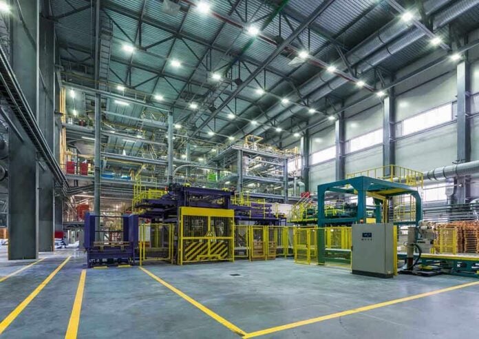 shutterstock_242575054 Interior view of a modern industrial facility with manufacturing equipment
