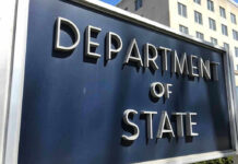 Visa Crackdown Hits Birth-Tourism Rings Department of State sign in front of building.
