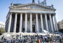 Supreme Court Smacks Down California Courthouse facade with media crews setting up outside.