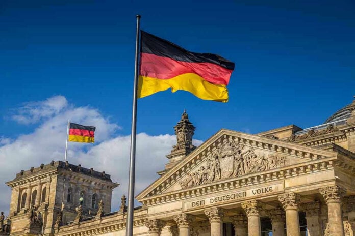 526234636 German flags at the Reichstag building in Berlin.