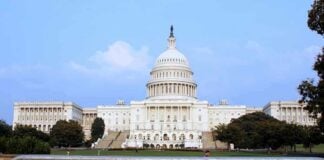 July 4 250th Celebration Becomes Political Flashpoint View of the U.S. Capitol building with a security barrier in front