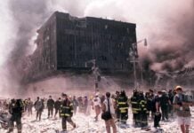 Senators Holds Travel Budget Emergency responders and civilians amidst debris at a disaster site