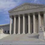 Virginia Gun Ban Faces Open Defiance The Supreme Court building featuring large columns and statues