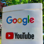 Your Phone Is Rewiring Your Brain Google and YouTube sign with trees in background.