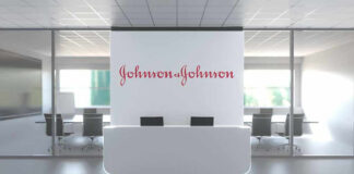 Most Mothers Say Parenthood Cost Them Career Growth Office lobby with Johnson & Johnson logo.