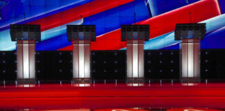 Clock Wars Heat Up In Congress Four debate podiums on a CNN stage background.