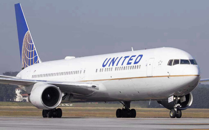 623296490-1 United Airlines plane on the runway.