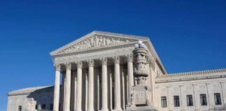 Spyware Bombshell: Greek Court to Hear Landmark Case The Supreme Court building with large columns and a clear blue sky