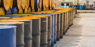 Oil Shock Warning: Hormuz Standoff Escalates Rows of oil barrels in a storage facility