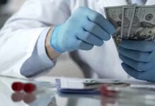 Scientists Find Moon-Like World That Doesn’t Fit Category Gloved hands in a lab coat counting US dollar bills