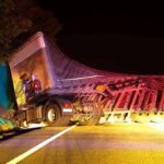 Dashcam Twist Deepens Mystery in Fatal Ohio Truck Crash An overturned truck on the side of the road at night with emergency lights