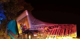 Dashcam Twist Deepens Mystery in Fatal Ohio Truck Crash An overturned truck on the side of the road at night with emergency lights