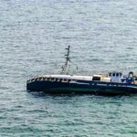 Sudden Storm: Three Children Die in Wisconsin Lake Tragedy An abandoned boat floating on the ocean surface