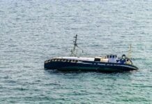 Sudden Storm: Three Children Die in Wisconsin Lake Tragedy An abandoned boat floating on the ocean surface