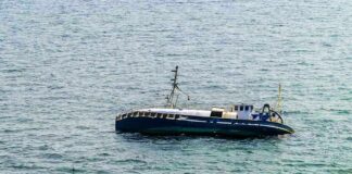 Sudden Storm: Three Children Die in Wisconsin Lake Tragedy An abandoned boat floating on the ocean surface