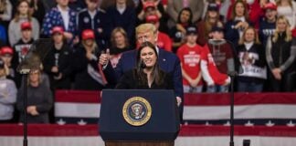Viral Clip Reignites Debate Over Whether Character Matters in Politics speaker at presidential podium during rally