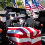 Another American Hero Has Been Identified U.S. Marines carry a flag-draped casket into a hearse