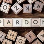Minnesota Pardoned Him. DHS Deported Him Anyway Wooden letter blocks arranged to spell 'PARDON' on a wooden surface