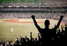 Historic Victory, Massive Controversy: Team USA Moves On Crowd of fans cheering at a baseball game in a stadium