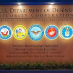 Pentagon Schools Center Christianity in New Course U.S. Department of Defense display wall with service seals