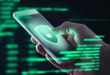 Hand holding smartphone with security lock icon on screen