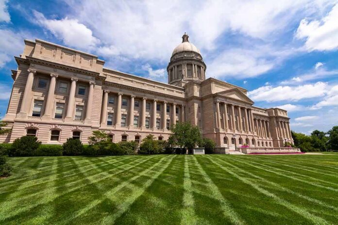 shutterstock_1477195427 Neoclassical capitol building with dome and columns on a manicured lawn