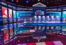 The Circumcision Question That Set Off A National Debate Televised debate stage with multiple podiums and bright red, white, and blue lighting