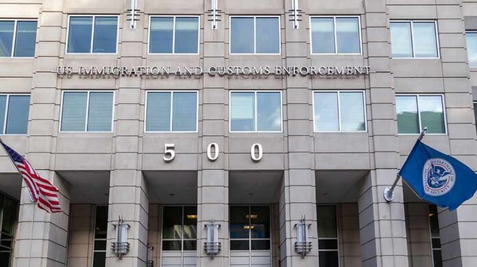 US government building facade with flags and number 500