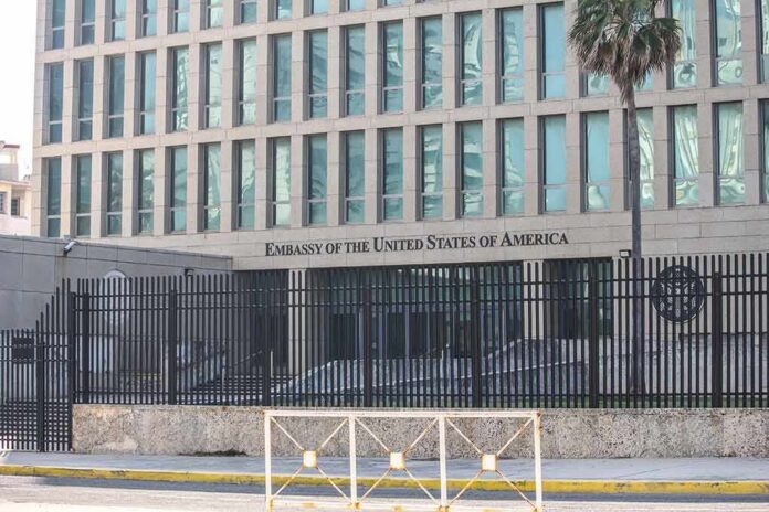 Embassy building behind tall black security fence