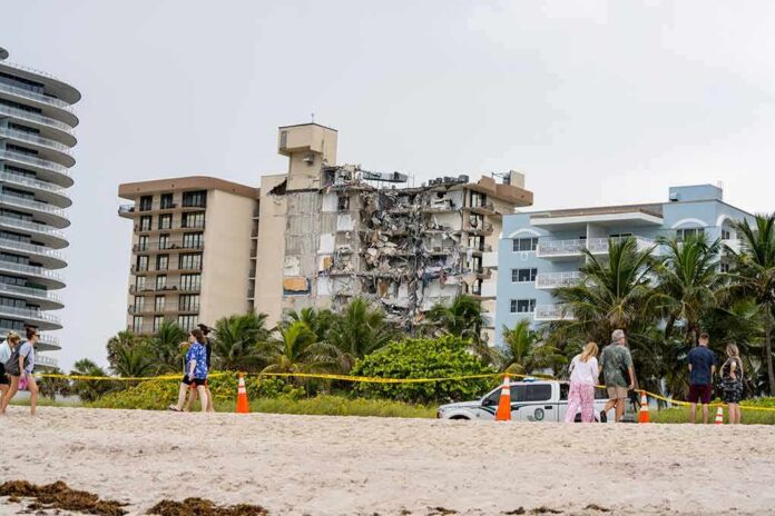 shutterstock_1996561025 Partially collapsed beachfront condominium building