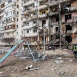 Brooklyn Apartment Fire Linked to Lithium-Ion Battery Kills Teen Damaged apartment building behind a playground slide