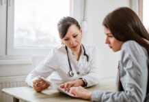 Late-Stage Drug Trials Offer New Hope for PTSD Doctor consulting a patient at a desk