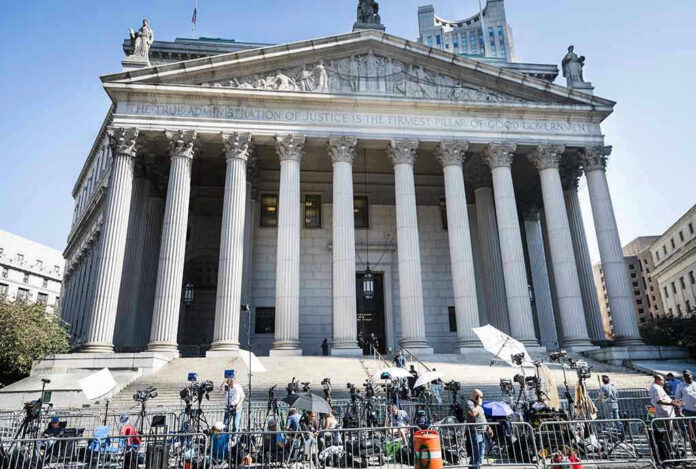 2445868619-2 Reporters and photographers gathered outside a neoclassical courthouse