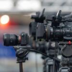Professional video cameras on tripods