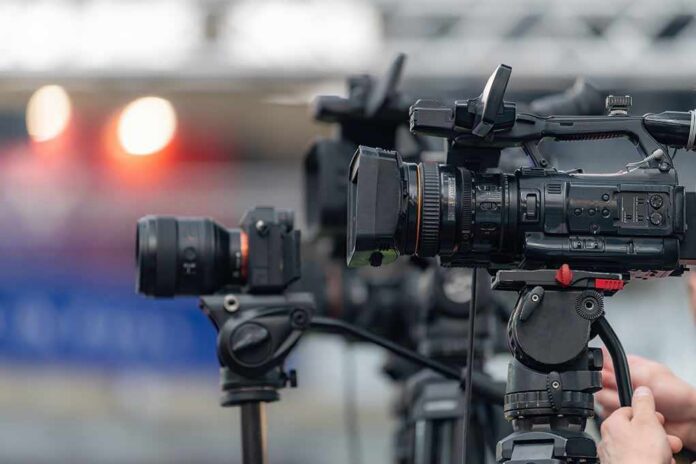 Professional video cameras on tripods