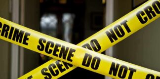 Toddler Killed by Mom Because He Was “The Anti-Christ” Yellow crime scene tape crossing a doorway