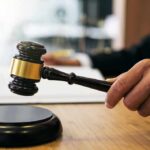 Crimes: Judge Removes DA’s Office Judge's hand holding a gavel over a sound block