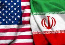 Iran Links Hormuz Reopening to Cease-Fire United States and Iran flags side by side