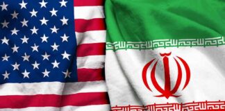 Iran Links Hormuz Reopening to Cease-Fire United States and Iran flags side by side