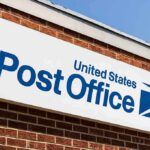 Court Rulings Leave Mail-Ballot Rules in Limbo Post Office sign on a brick building