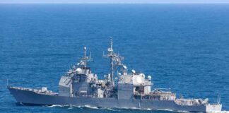 Iran Claims U.S. Submersible Capture Gray naval warship cruising on open sea
