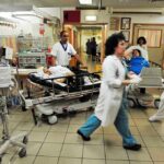 Hospital Drop-Off After Frat Night Medical staff attending to patients in a busy hospital emergency room