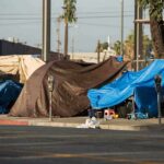 Border Shelters Sit Half-Empty as Migration Falls Street tents covered with tarps along a sidewalk