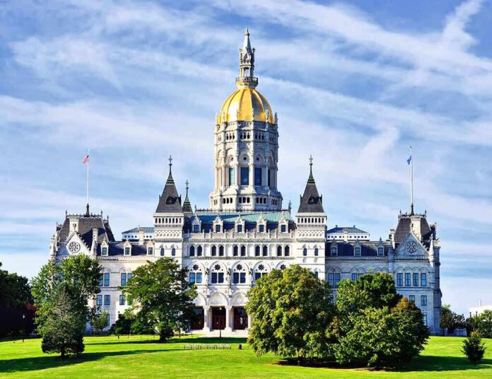 shutterstock_152023763 Connecticut State Capitol building with a golden dome and surrounding greenery