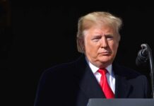 Taxpayer-Funded Trump Ad Airs on Cable Donald Trump at a podium with a microphone