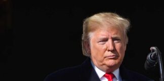 Taxpayer-Funded Trump Ad Airs on Cable Donald Trump at a podium with a microphone