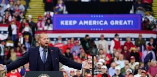 Trump’s Wild Dallas Power Play Crowd at a political rally with a speaker at a podium; Stephen Paea, Curtis Lofton, Walter Jones, John Sullivan, and Colin David Jones present