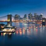 Fire on the Brooklyn Bridge Sparks Safety Questions After July 4 Show Brooklyn Bridge over river with illuminated city skyline at dusk